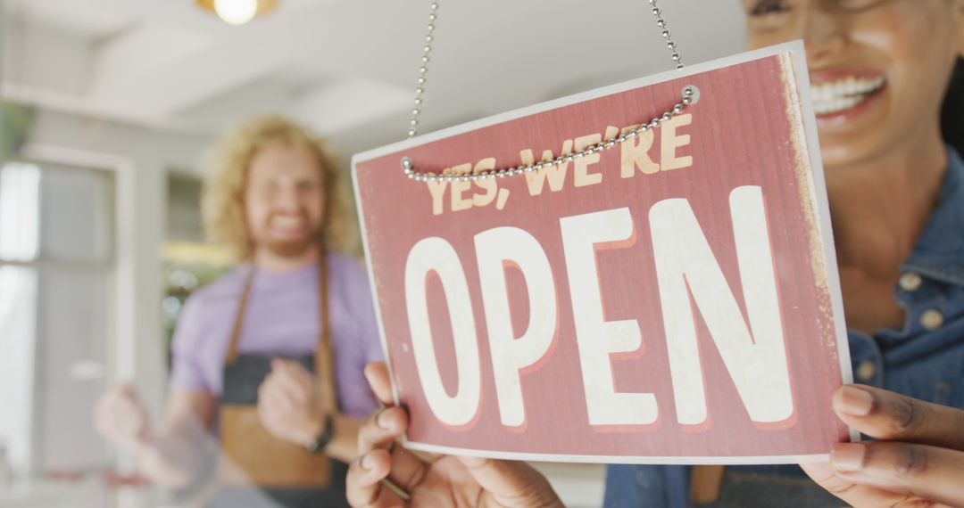 Baristas Opening Coffee Shop with Open Sign