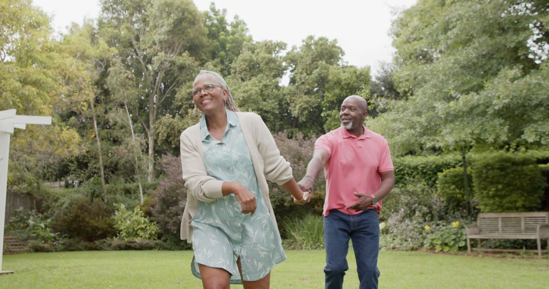 Senior Couple Enjoying Walk in Beautiful Garden