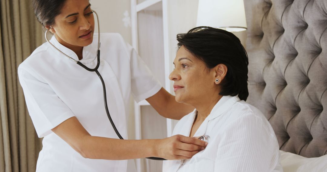 Nurse Checking Senior Woman's Heartbeat at Home Health Care Visit - Free Images, Stock Photos and Pictures on Pikwizard.com