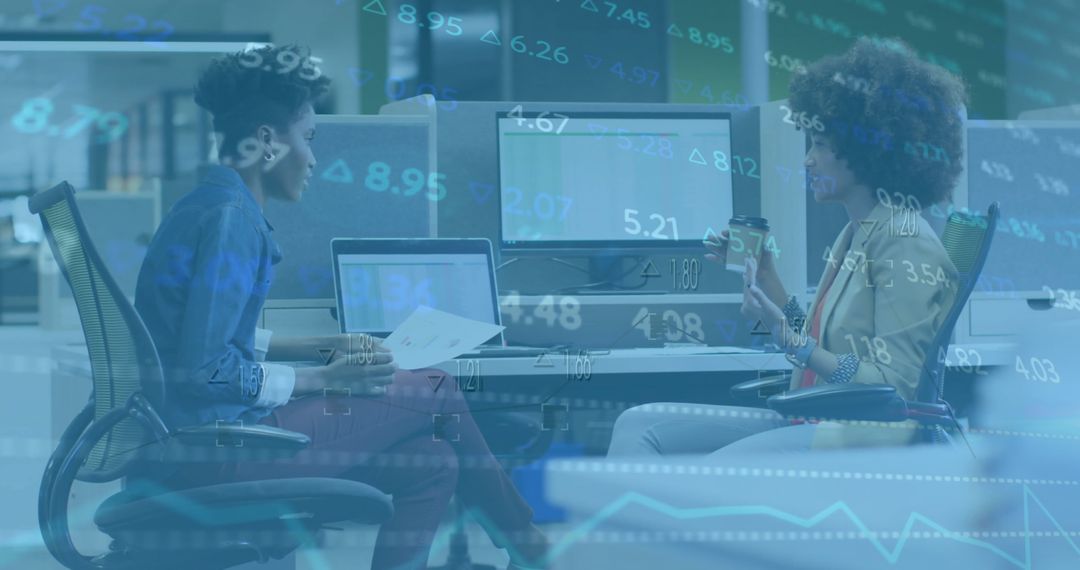 Diverse Professionals Discussing Financial Data Insights in Modern Office