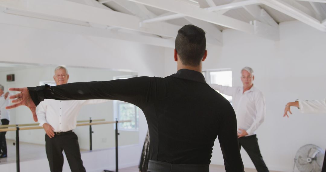 Dance Instructor Leading Elderly Men in Ballroom Class