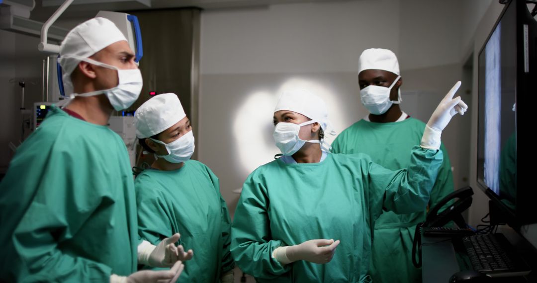 Diverse Medical Team Reviewing X-Ray During Surgery - Free Images, Stock Photos and Pictures on Pikwizard.com