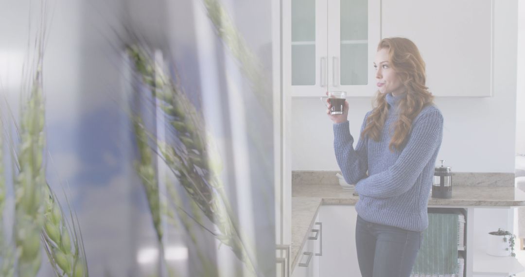 Woman Relaxing with Coffee in Modern Kitchen with Overlay of Wheat Field