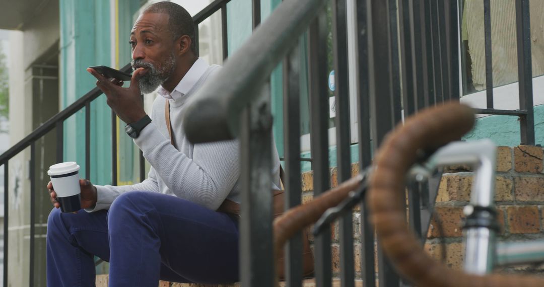 Businessman taking voice notes during coffee break outdoors - Free Images, Stock Photos and Pictures on Pikwizard.com