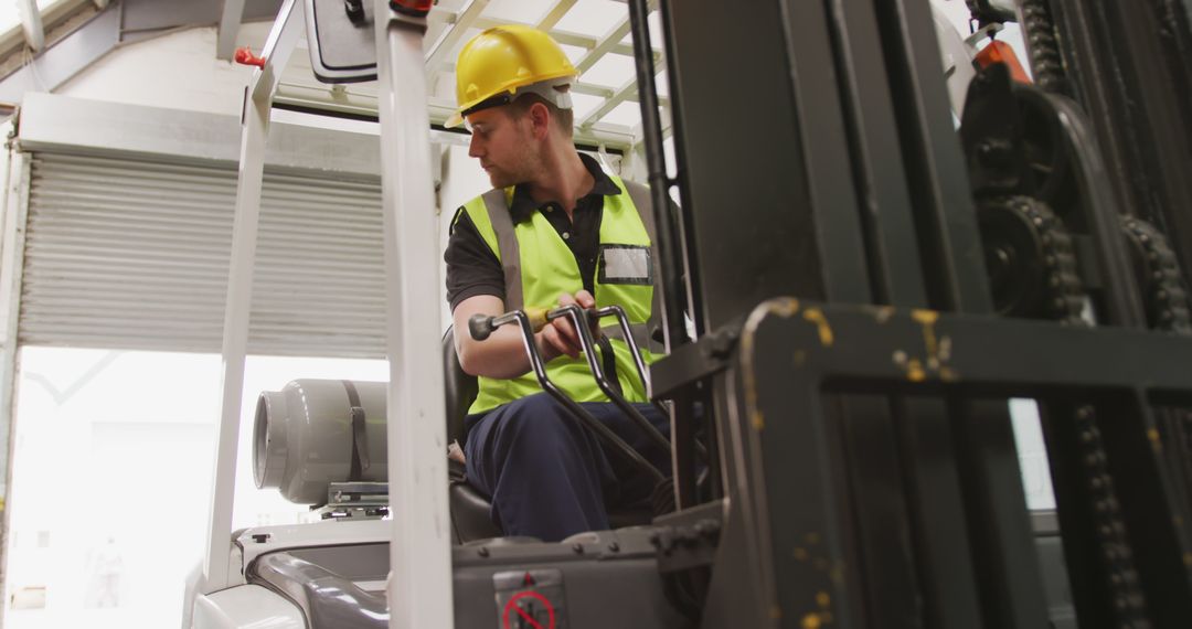 Caucasian Worker Operating Forklift in Industrial Warehouse - Free Images, Stock Photos and Pictures on Pikwizard.com