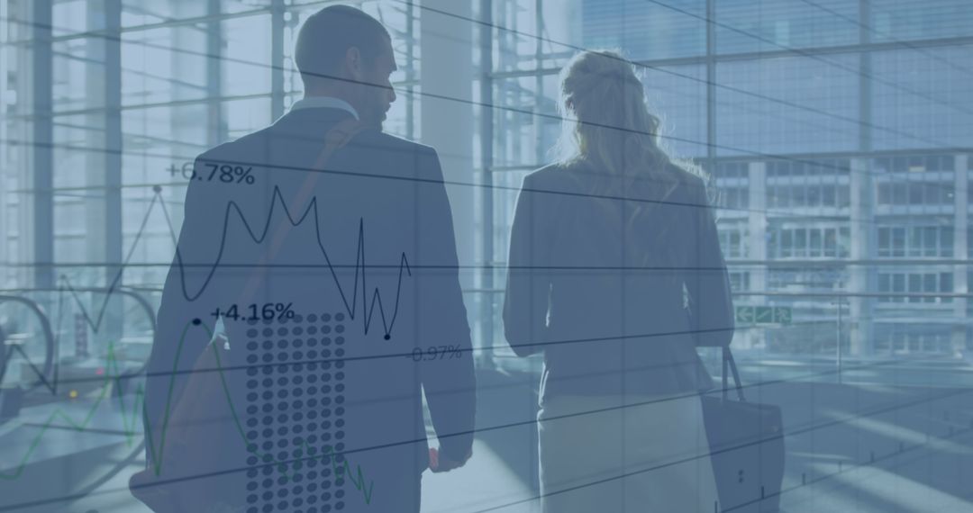 Business Professionals Overlapping Financial Graphs in Office Environment