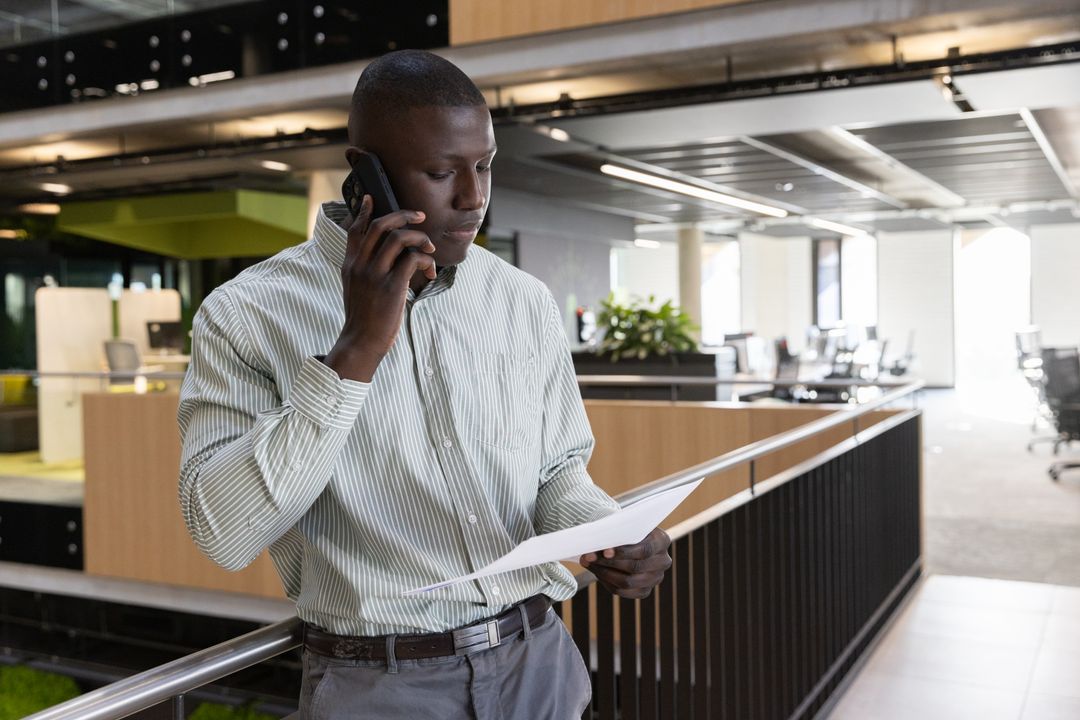 Professional Reviewing Document on Office Balcony