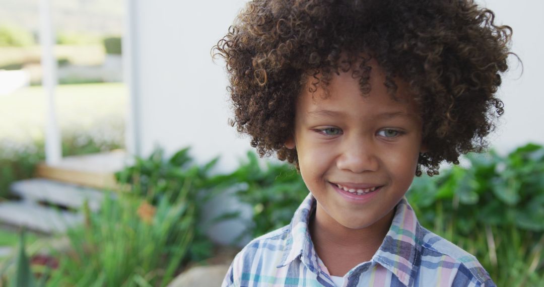 Image of happy smiling biracial boy outside of house - Free Images, Stock Photos and Pictures on Pikwizard.com