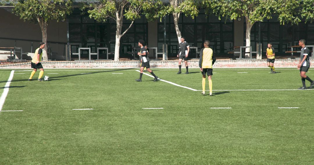 Youth Soccer Team Practicing on Green Field