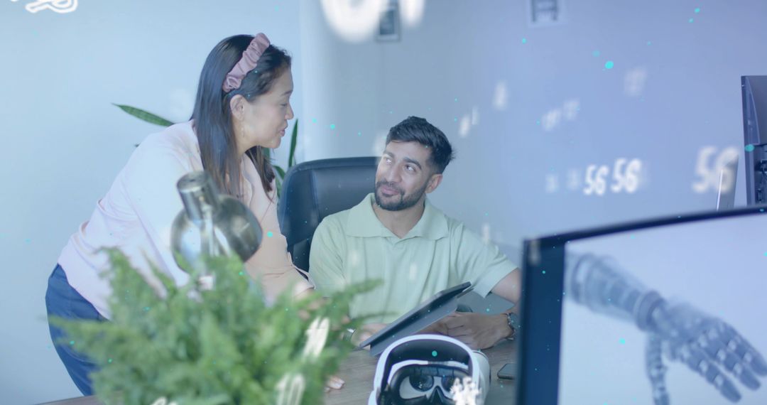 Modern Team Collaborating on Innovative Robotics Design in Office Environment