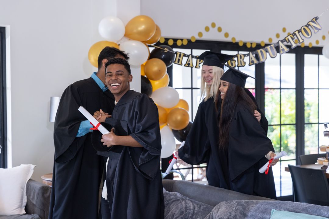 Diverse Graduates Celebrating at Home Party with Balloons and Banners
