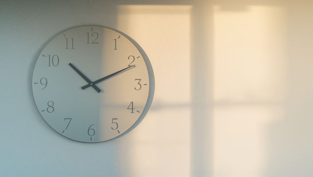 Sunlit Minimalist Wall Clock Casting Window Shadow with Soft Morning Light