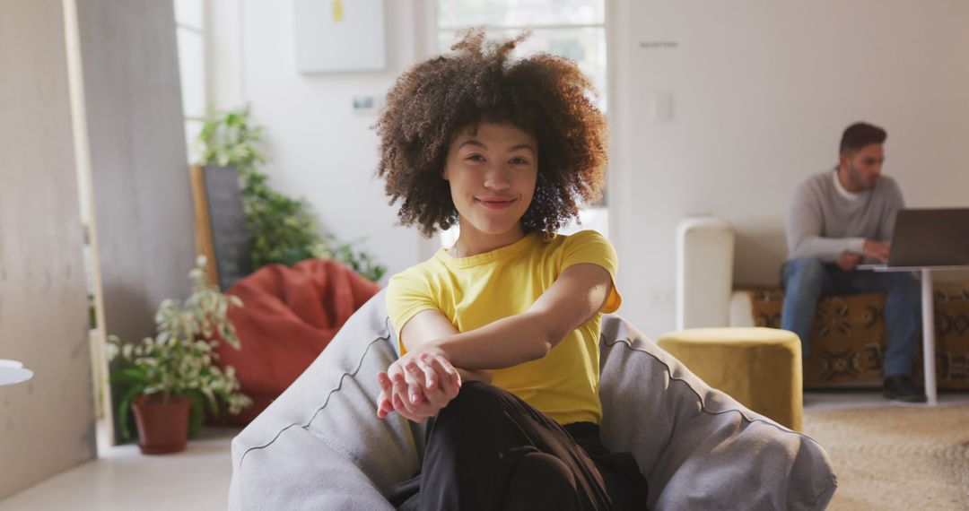 Smiling Biracial Creative in Stylish Office Lounge