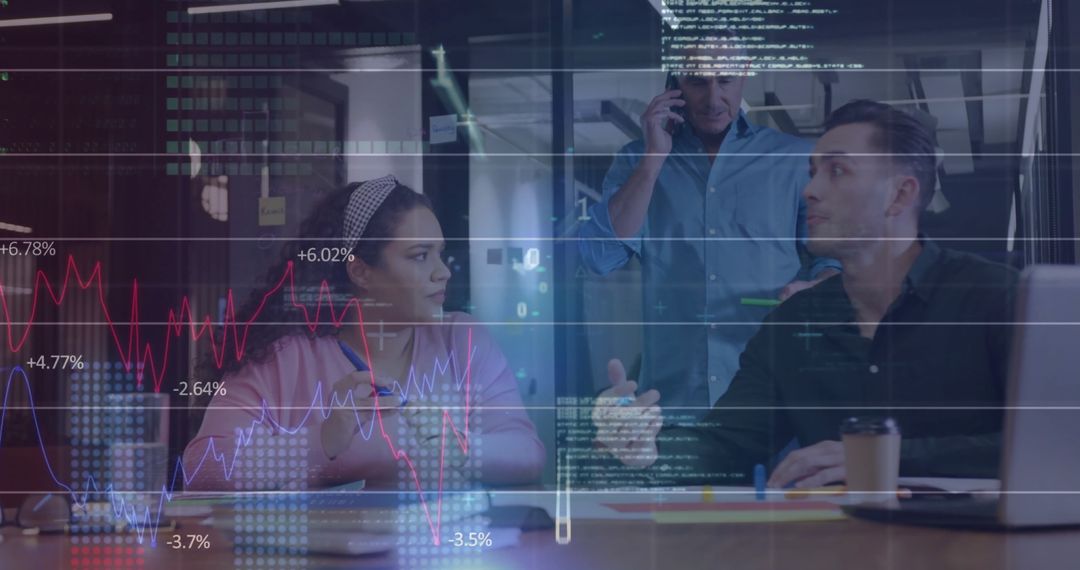 Diverse Team Analyzing Data and Graphs in Modern Office Environment