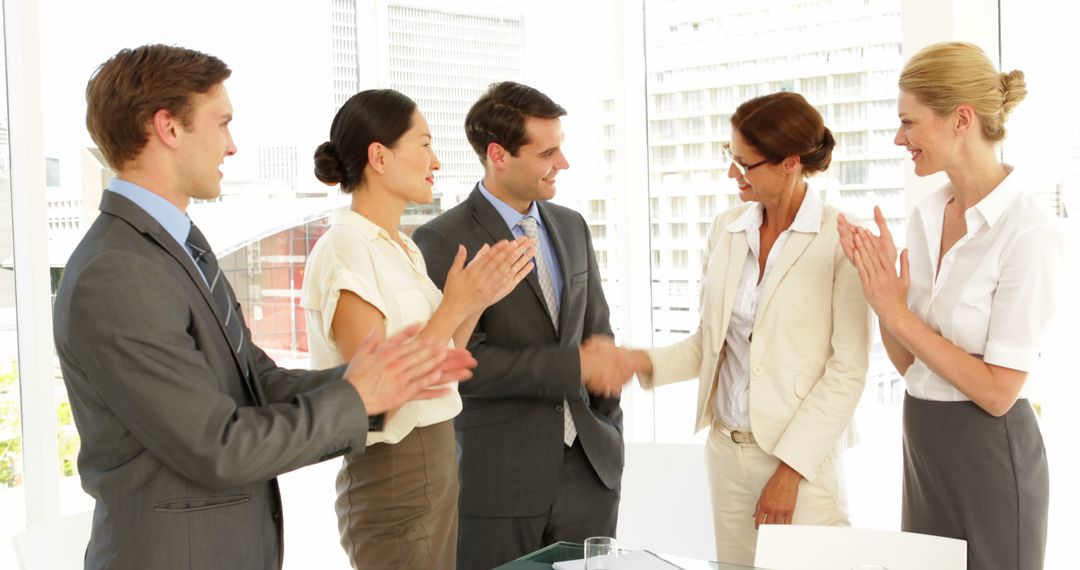 Business People Shaking Hands and Applauding in Office Meeting - Free Images, Stock Photos and Pictures on Pikwizard.com