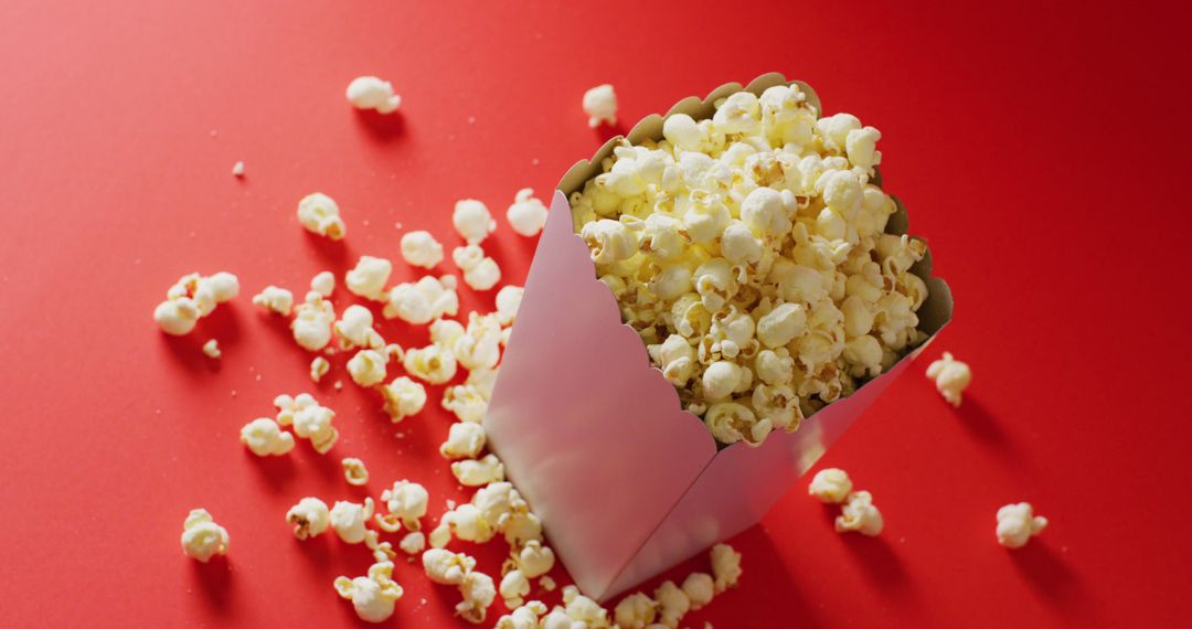 Close Up of Popcorn in Box on Red Background