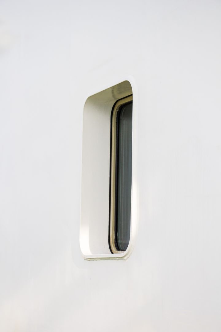 Side View of Modern Boat Window on White Exterior - Free Images, Stock Photos and Pictures on Pikwizard.com