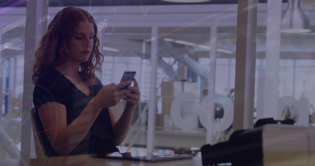 Woman Using Smartphone in Open-Plan Office