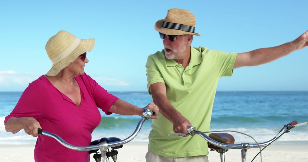 Senior Couple Enjoying Biking Together on Beach - Free Images, Stock Photos and Pictures on Pikwizard.com