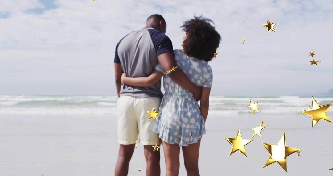Romantic Couple Overlooking Ocean with Floating Golden Stars
