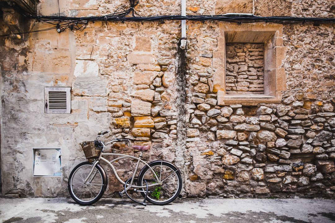 Vintage Bicycle Against Rustic Stone Wall