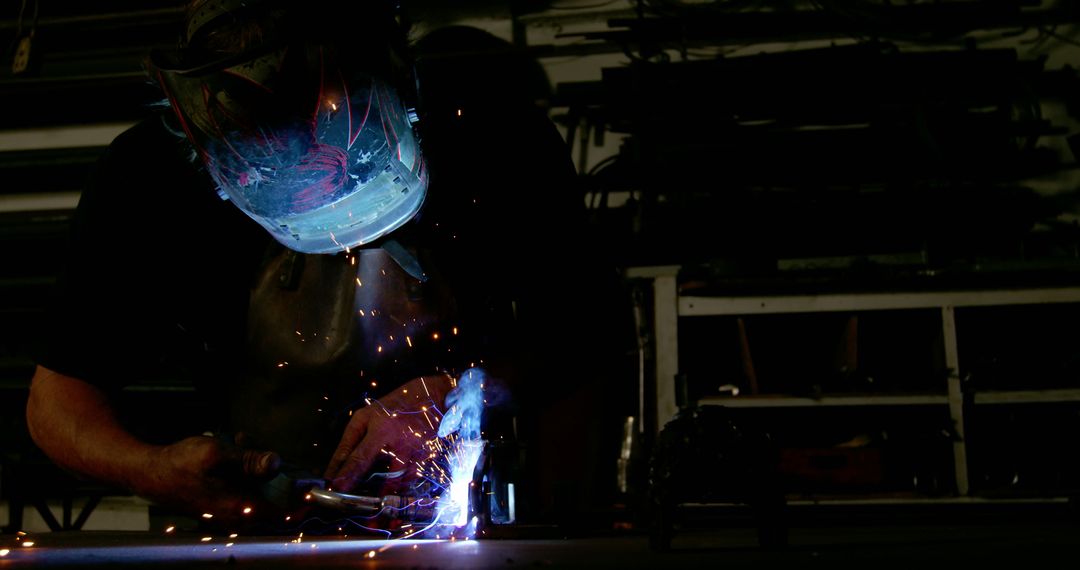 Welder Working with Protective Mask and Sparks - Free Images, Stock Photos and Pictures on Pikwizard.com