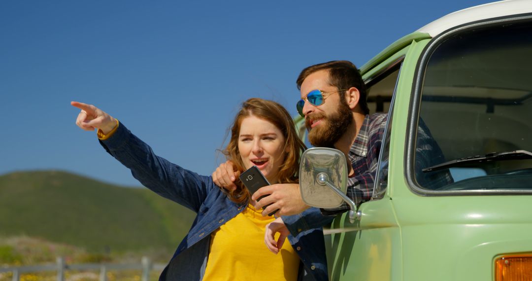 Couple Road Tripping in Classic Van Enjoying Scenic View