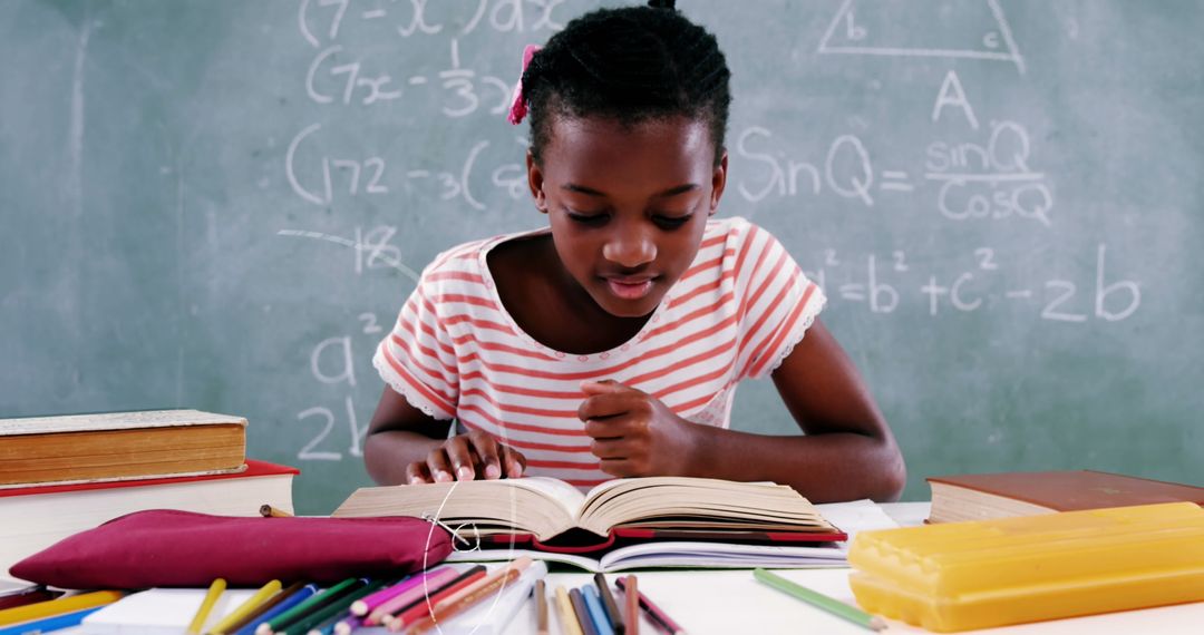 Focused Schoolgirl Studying by Chalkboard with Mathematical Equations