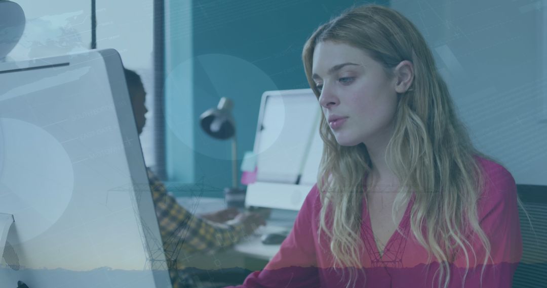 Businesswoman Analyzing Data on Computer with Financial Overlay