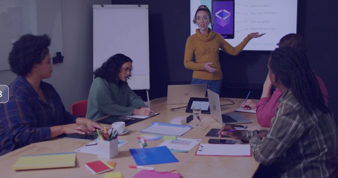 Woman Giving Presentation on Smartphone App Design in Modern Office