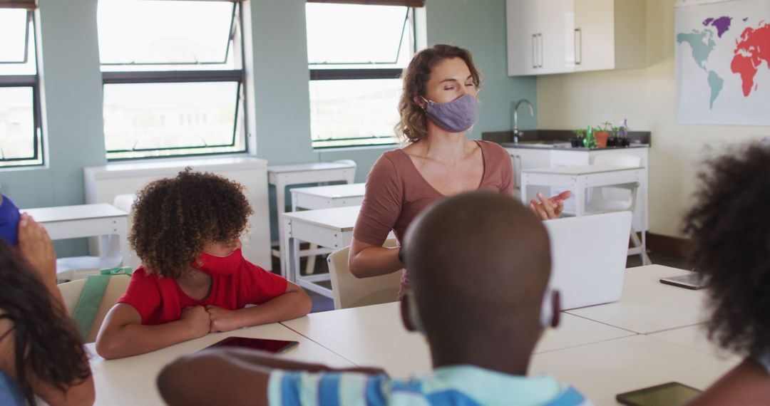 Teacher Engaging with Elementary Students in Classroom with Masks - Free Images, Stock Photos and Pictures on Pikwizard.com