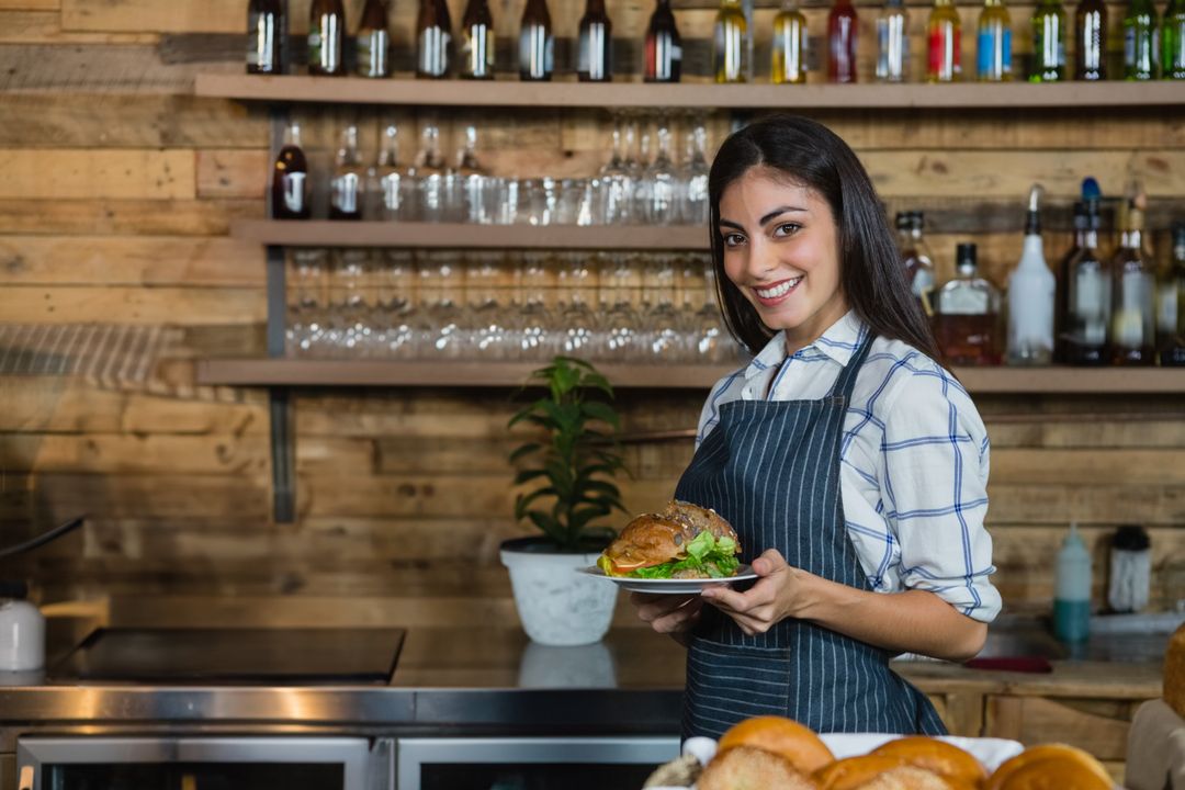 Smiling Server Holding Gourmet Sandwich in Cozy Cafe