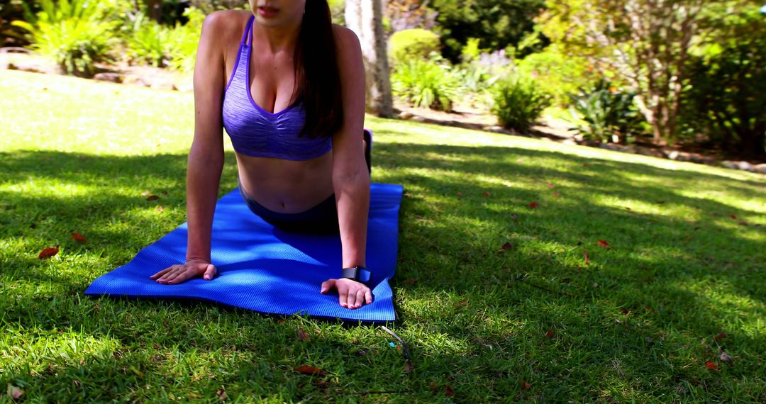 Woman Doing Yoga Outdoors on Blue Mat in Park - Free Images, Stock Photos and Pictures on Pikwizard.com