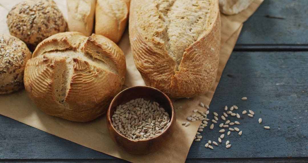 Assorted Artisan Breads on Rustic Wooden Surface