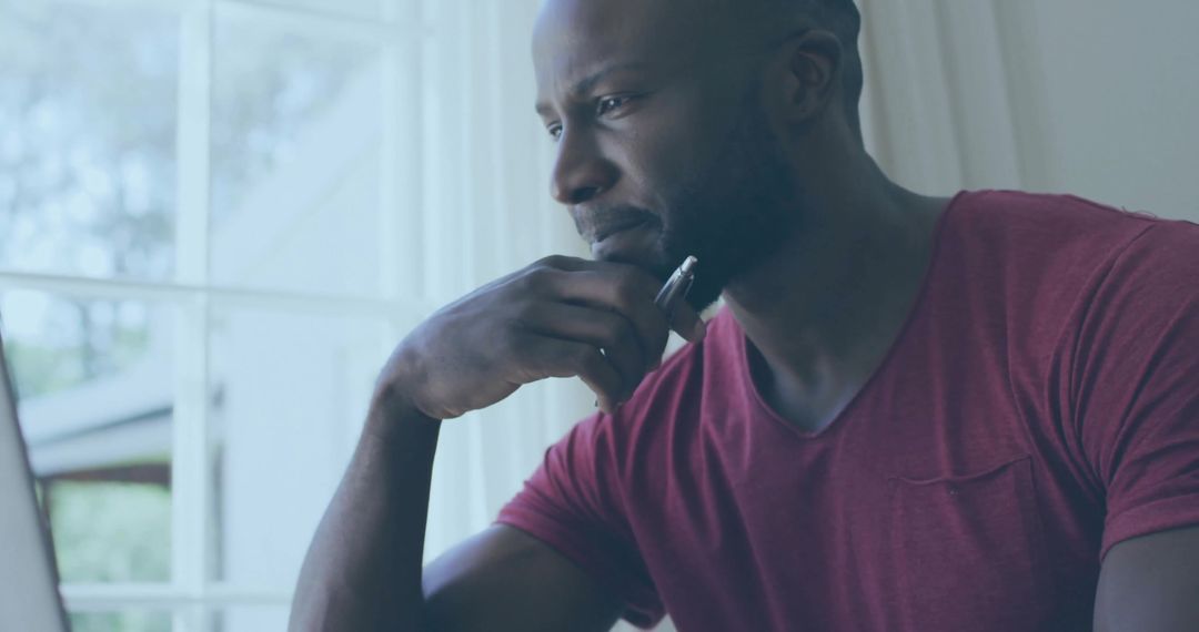 Focused Professional Working from Home in Cozy Atmosphere