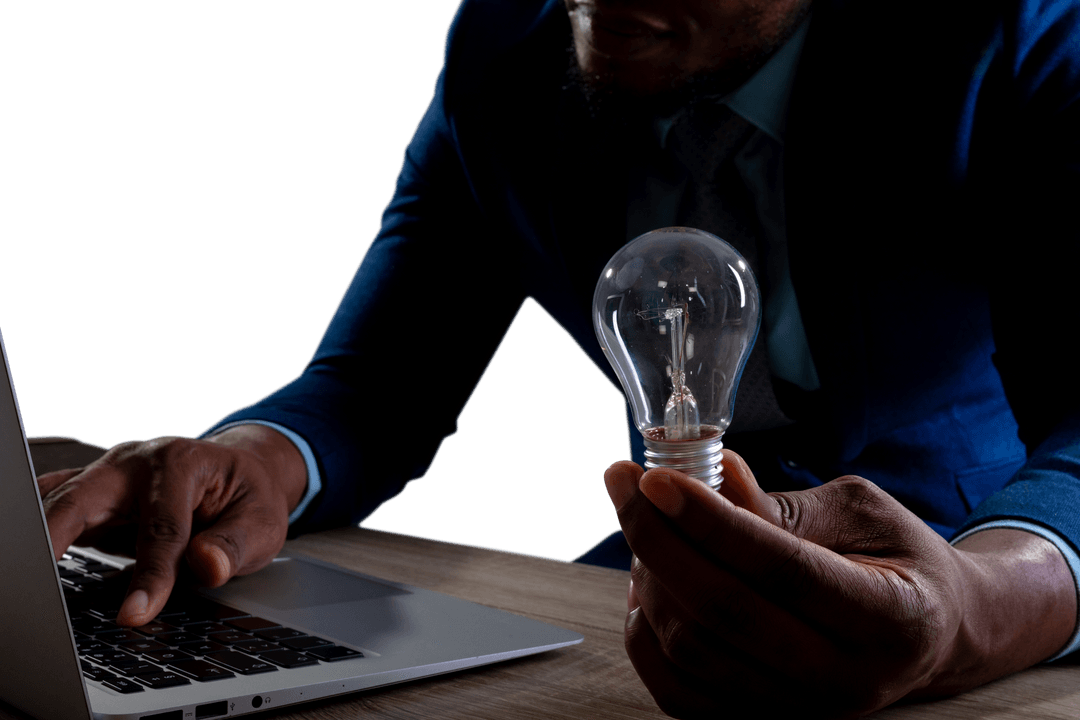 Transparent Conceptual Image Light Bulb and Laptop Businessman