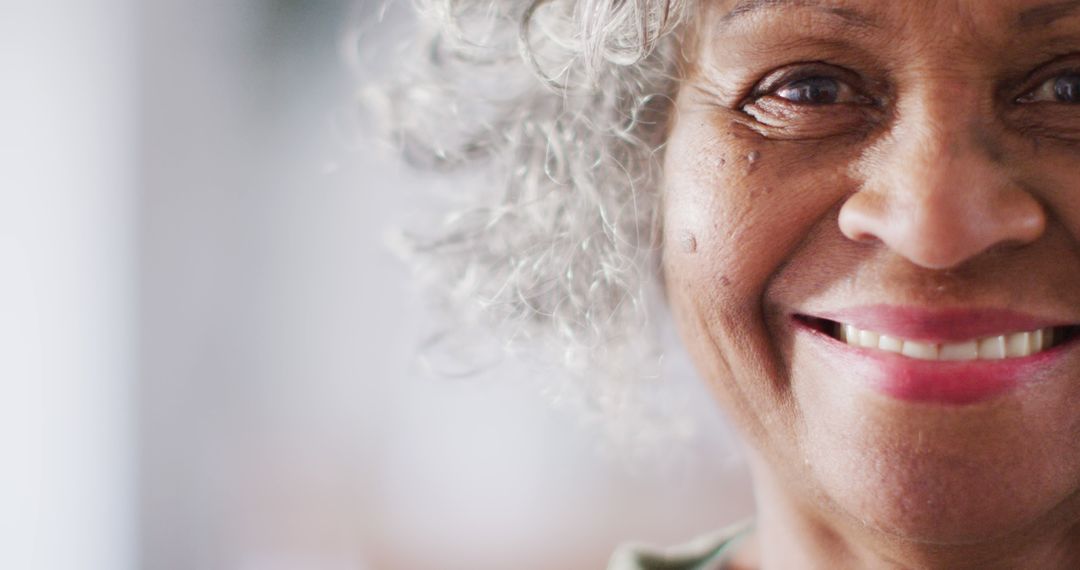 Close-Up of Smiling Elderly Woman with Gray Curly Hair - Free Images, Stock Photos and Pictures on Pikwizard.com