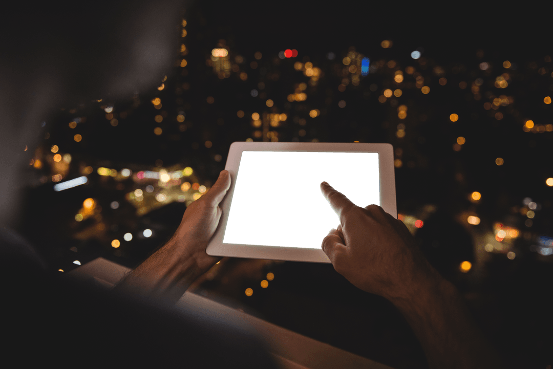 Transparent Touchscreen Tablet Usage Over Cityscape by Night