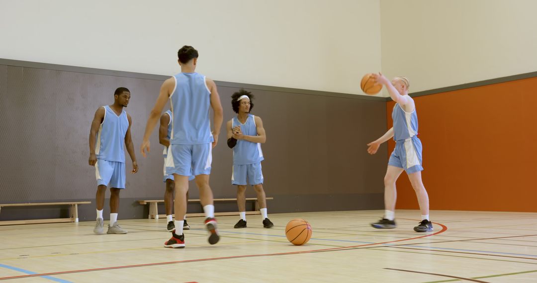 Diverse Basketball Team Practicing in Gym
