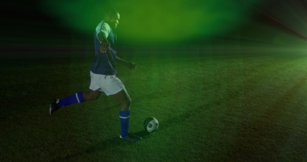 Soccer Player Kicking Ball with Green Light Effect Power and Motion