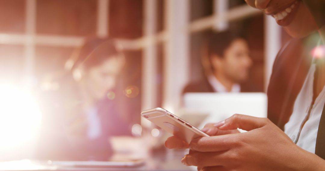Business Professional Using Smartphone in Bright Office
