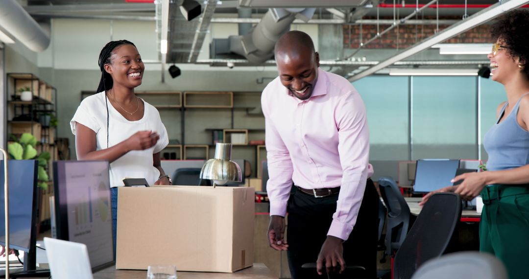 Colleagues Welcoming New Team Member in Modern Office Environment