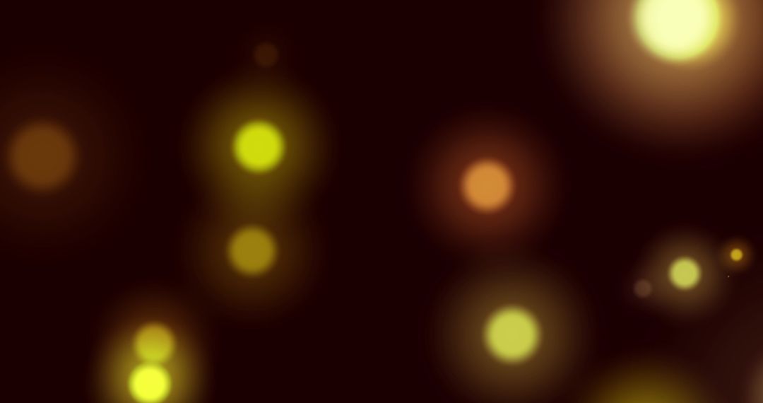 Abstract Glowing Yellow Light Bokeh on Black Background