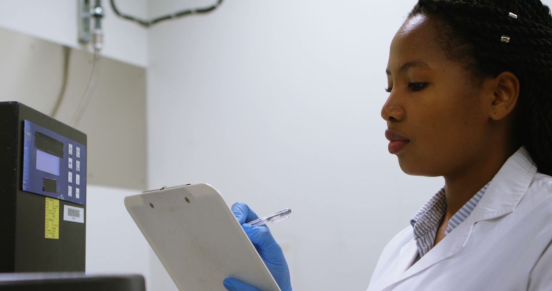 Young African American Female Scientist Recording Data in Laboratory - Free Images, Stock Photos and Pictures on Pikwizard.com