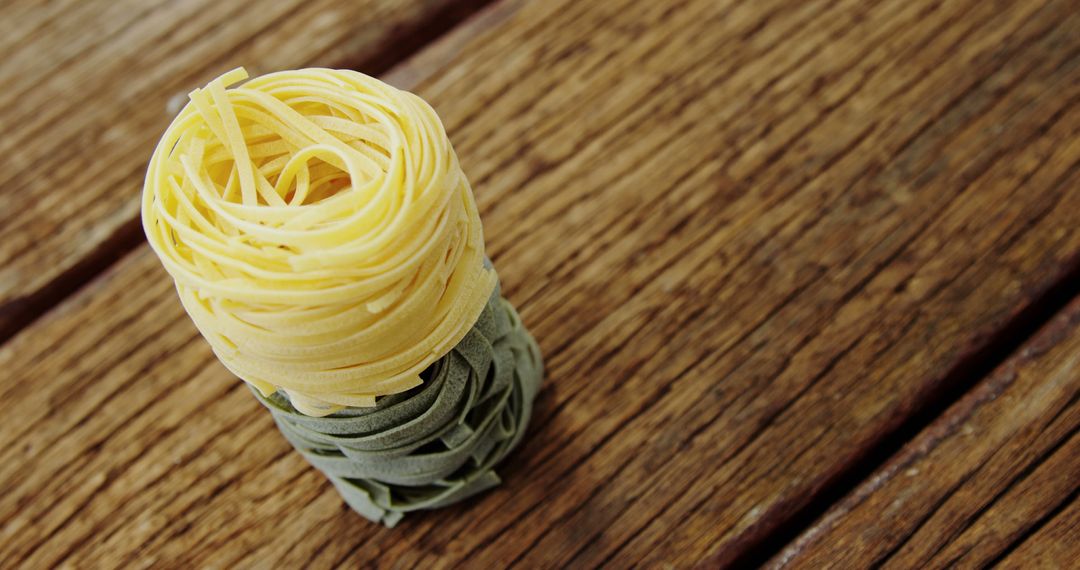 Assorted Pasta Nests on Wooden Table - Free Images, Stock Photos and Pictures on Pikwizard.com