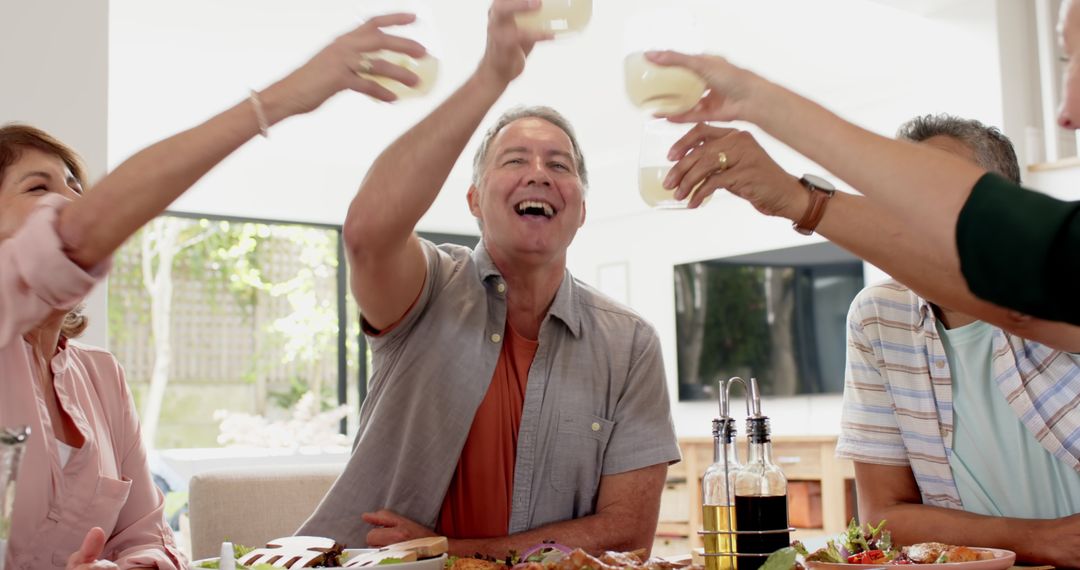 Smiling Family Enjoying Toast Around Dining Table