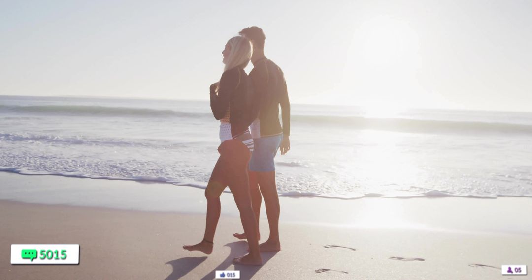 Romantic Couple Strolling on Sandy Beach at Sunset