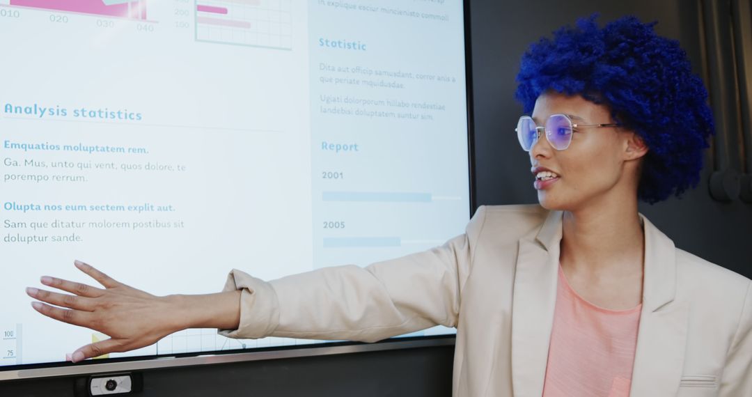 Businesswoman with Blue Wig Presenting Data on Whiteboard - Free Images, Stock Photos and Pictures on Pikwizard.com