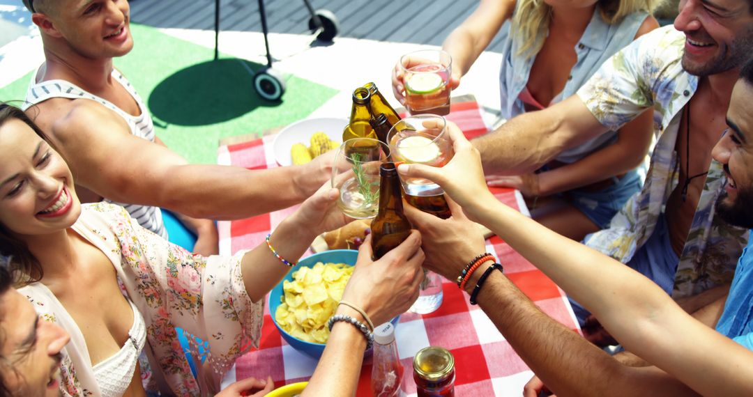 Cheerful Group of Friends Toasting at Outdoor Event - Free Images, Stock Photos and Pictures on Pikwizard.com