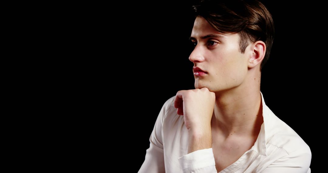 Man in Deep Thought with Dark Background